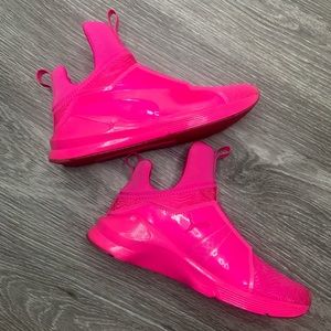 Neon pink puma sneakers